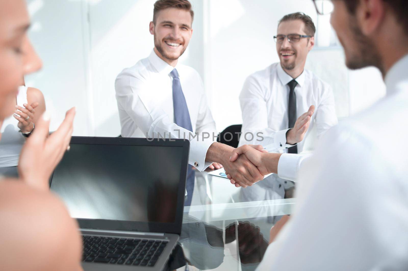 handshake of business people on a work Desk. by asdf