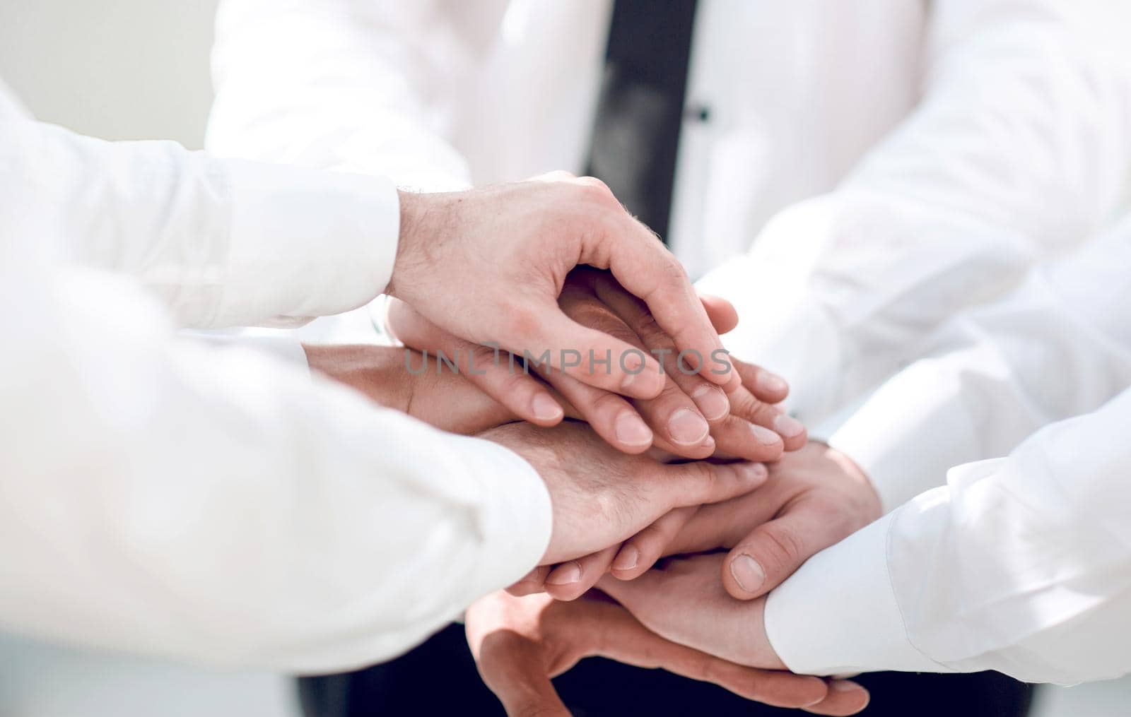 close up. business people with a stack of hands by asdf