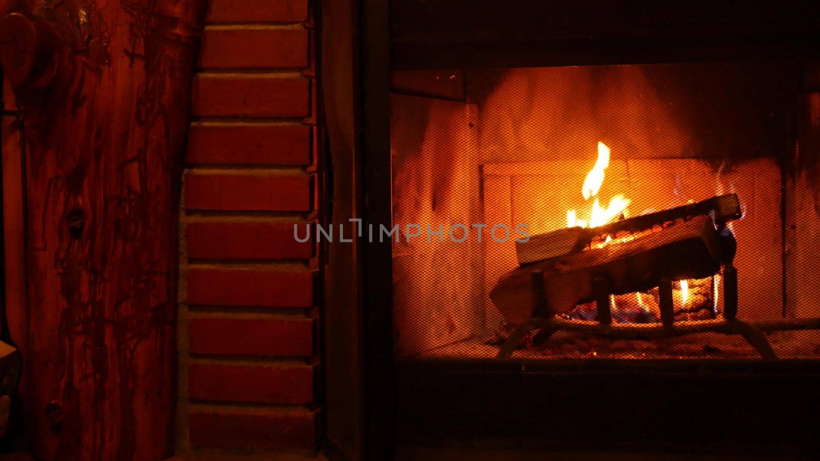 Fire in brick fireplace, firewood burning, wood blazing in cozy lodge or cabin. by DogoraSun