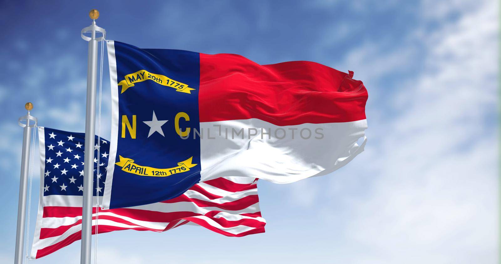 The North Carolina state flag waving along with the national flag of the United States of America by rarrarorro