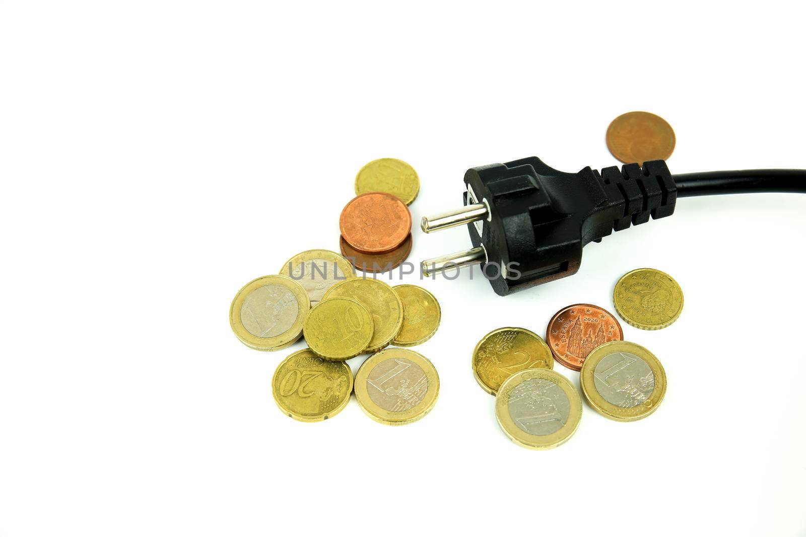 Black pin power plug and coins on white background