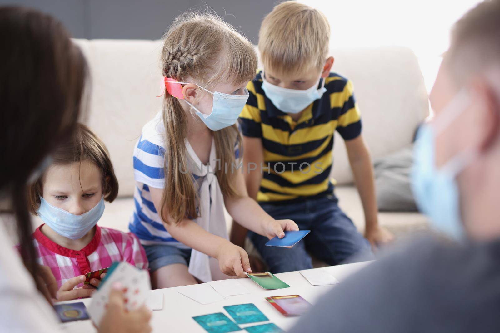 Kids in face masks, prevent virus spread in kindergarten, developing card game by kuprevich