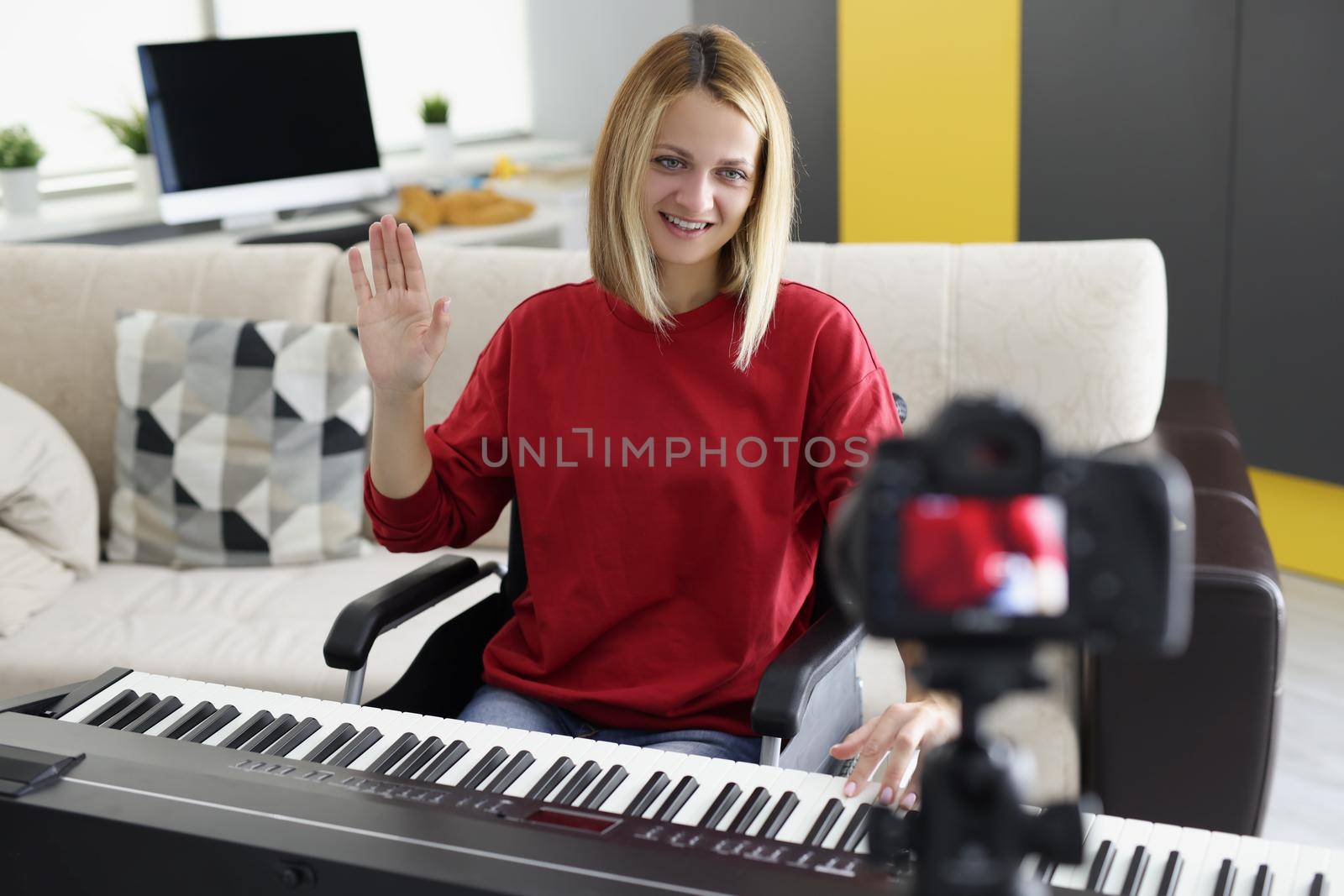 Portrait of disabled woman in wheelchair play piano on camera, talented pianist present her art for social media. Start blog, music, creativity concept