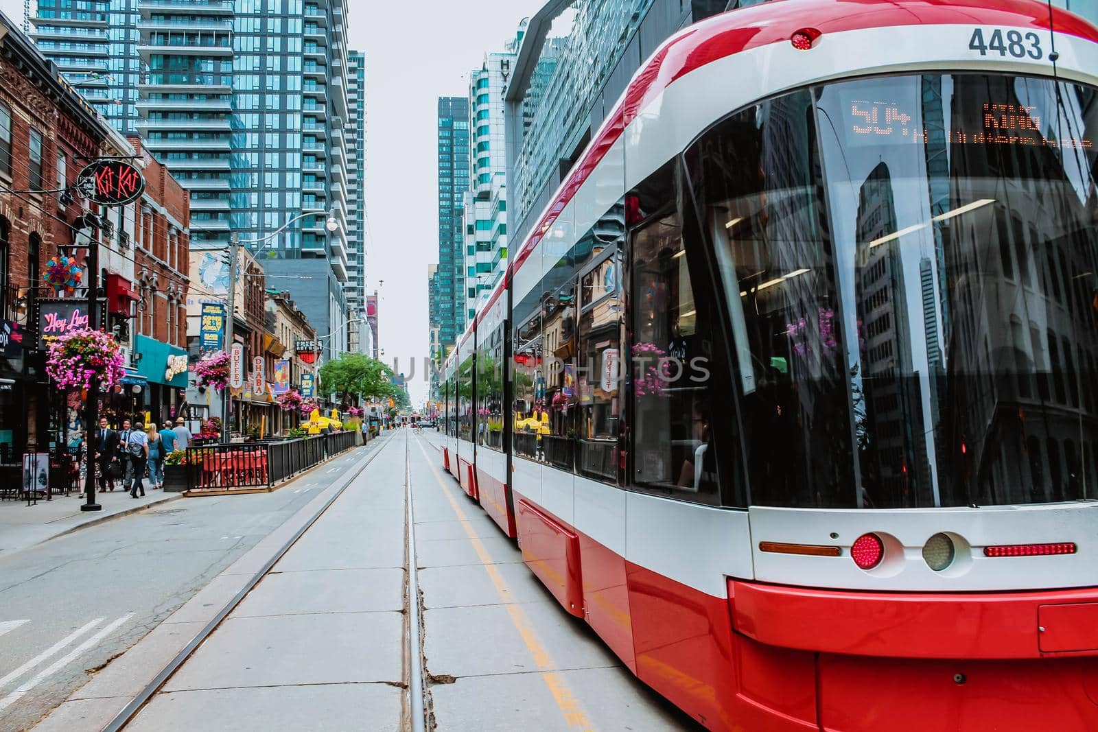 TTC Close view os a streetcar in downtown Toronto's entertainment district. New tram on streets of Toronto