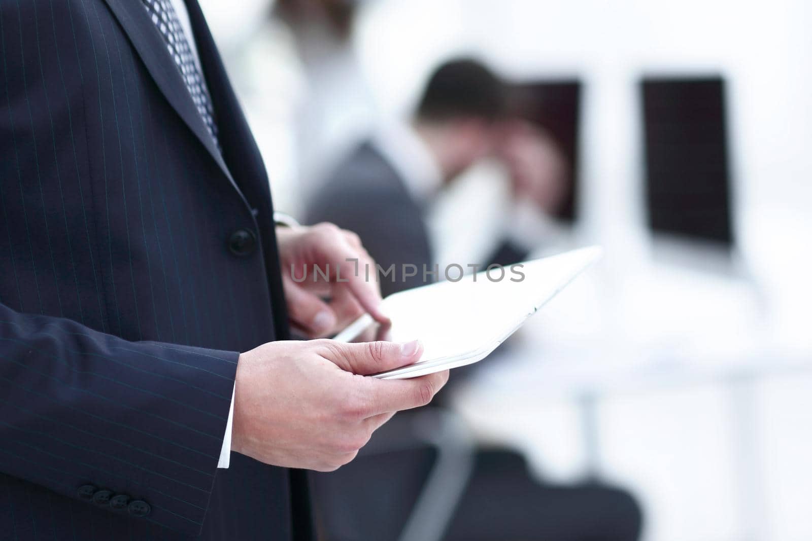 closeup.businessman working on tablet computer by asdf