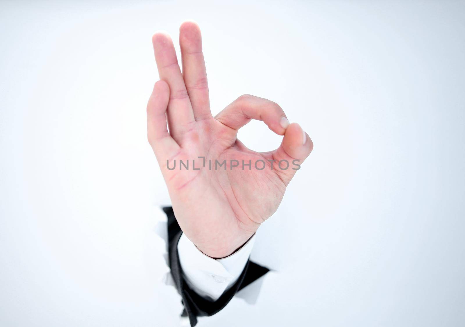 close up.hand businessman showing OK gesture.isolated on photo with copy space
