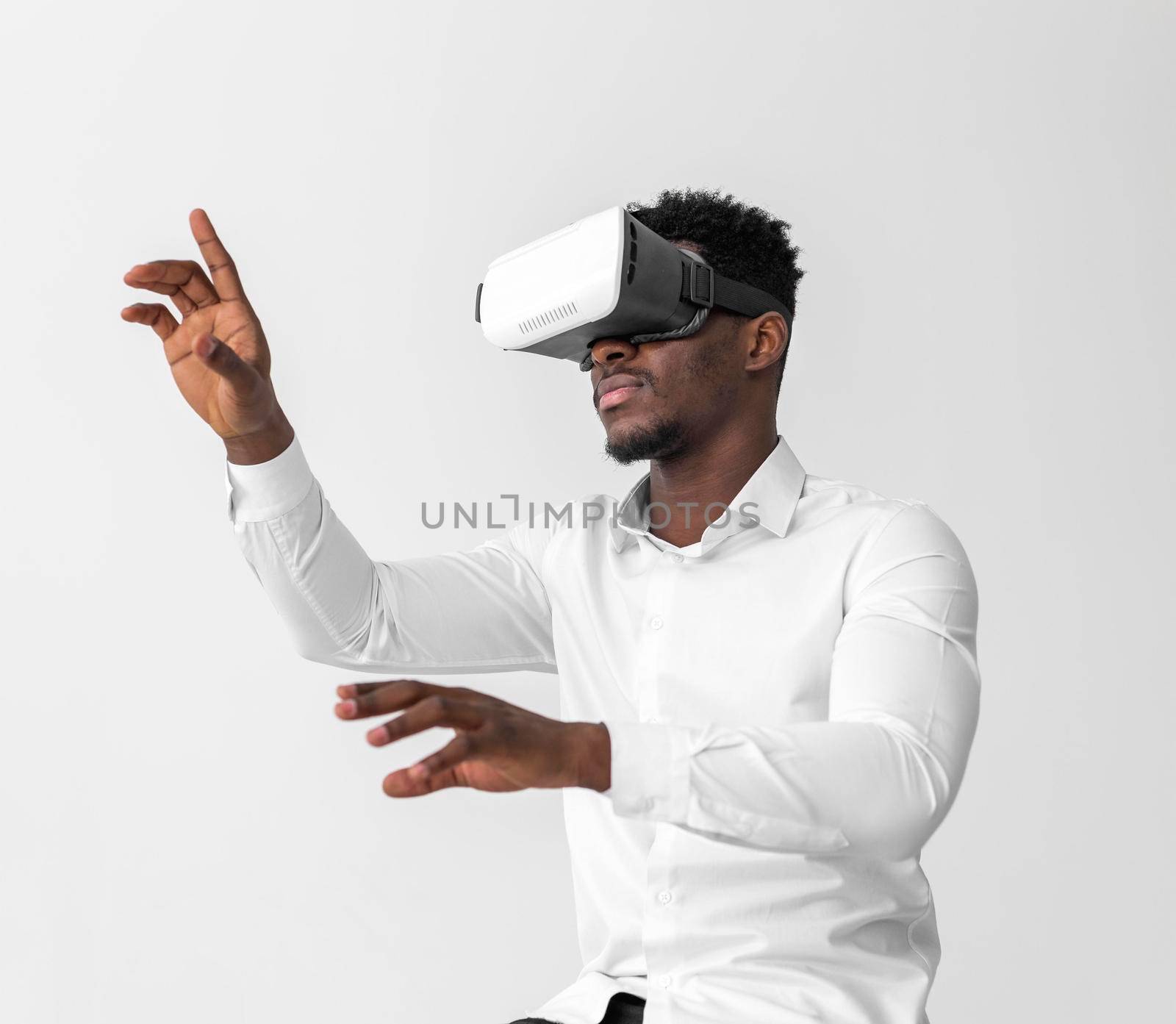 business african american man using virtual reality headset by Zahard