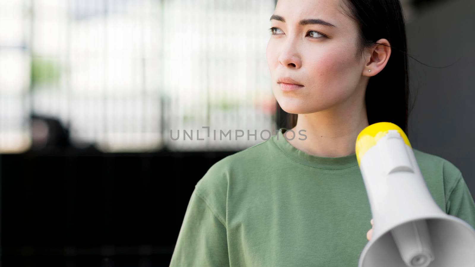 asian woman protesting holding megaphone by Zahard