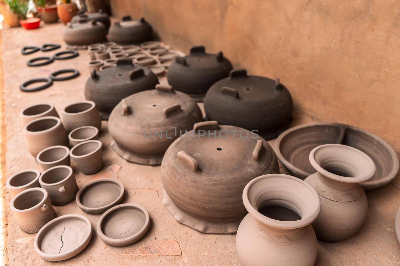 Clay pots drying in the sun in a craft workshop in La Paz Centro, Nicaragua. Concept of travel, culture and economy in poor countries by cfalvarez