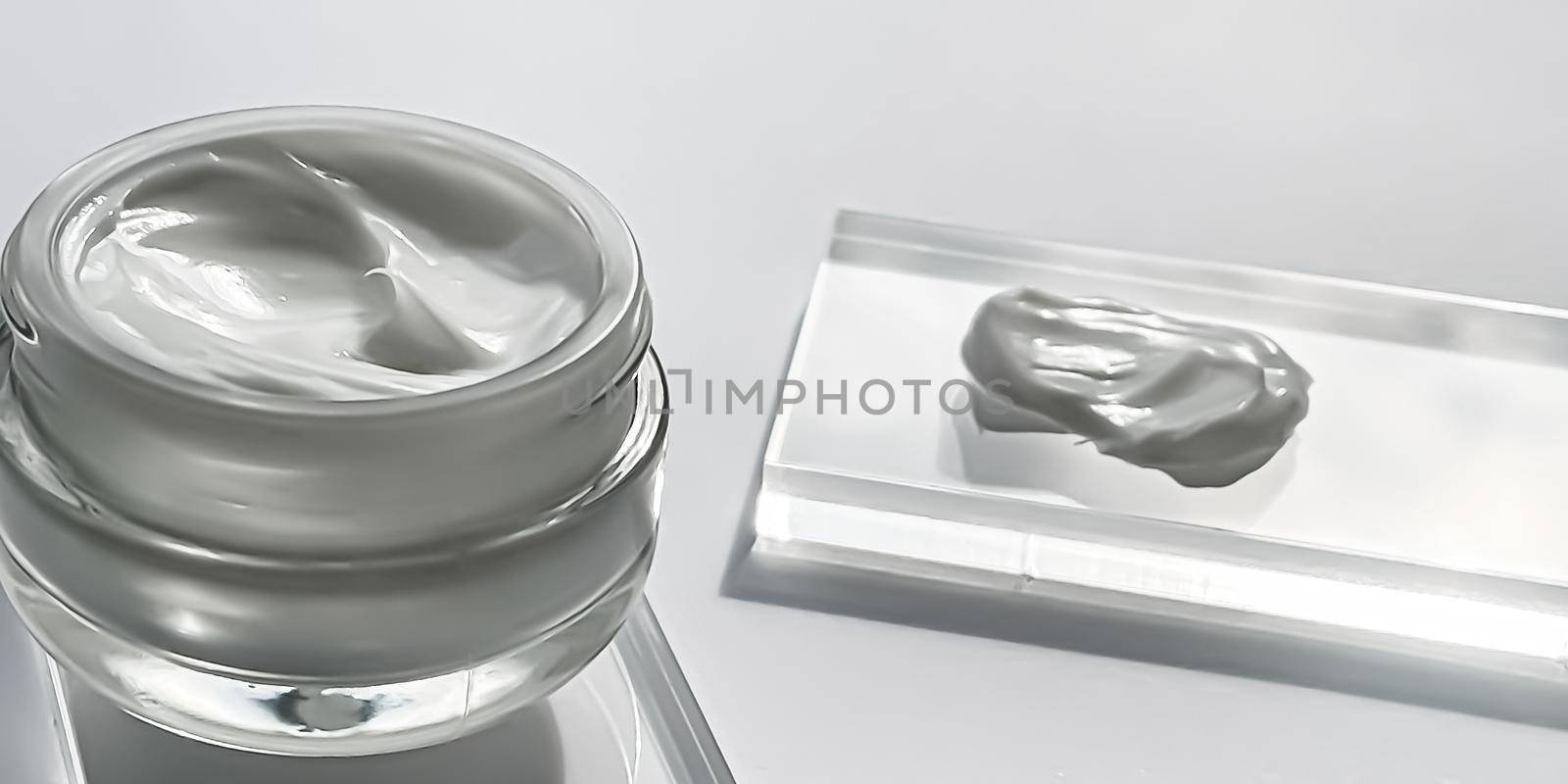 Face cream moisturiser jar and product sample on glass, beauty and skincare, cosmetic science concept