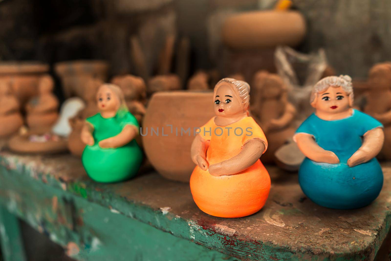 Clay dolls made by artisans from La Paz Centro, Nicaragua. Concept of culture and tourism in Latin America.