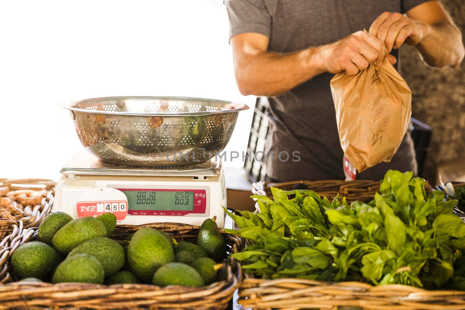 male vegetable seller packing vegetable customer market by Zahard