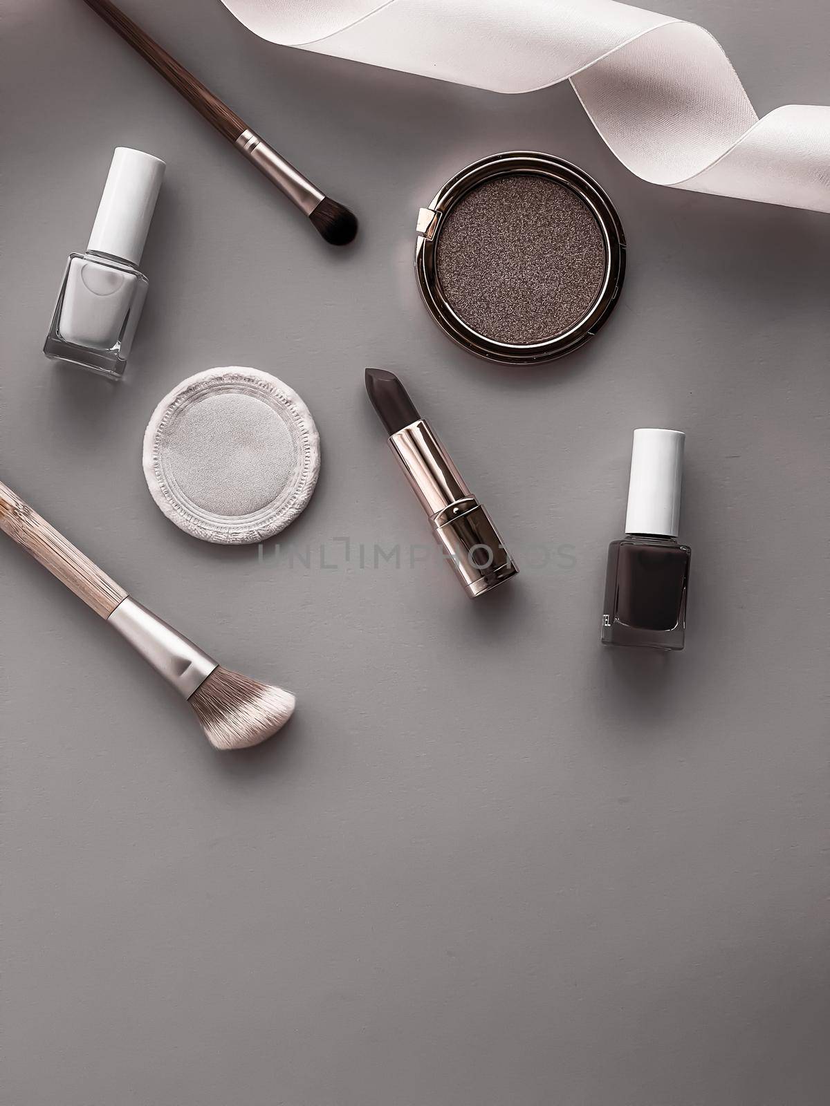 Beauty, make-up and cosmetics flatlay design with copyspace, cosmetic products and makeup tools on gray background, girly and feminine style concept