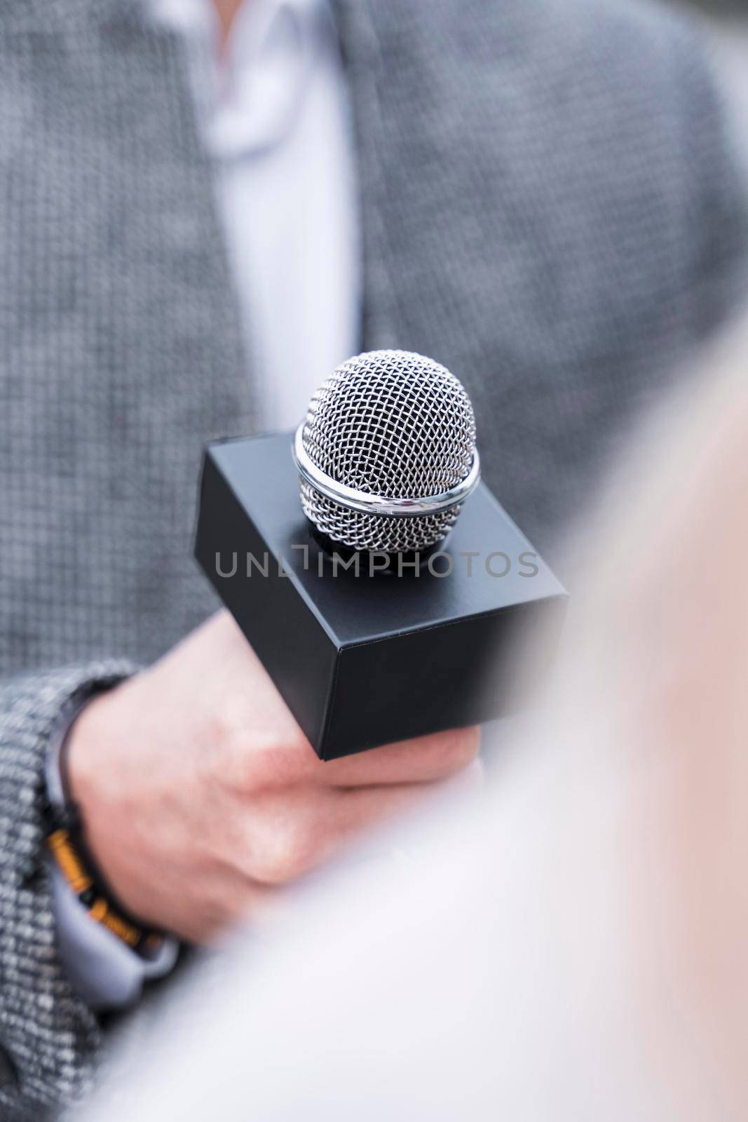 close up journalism microphone