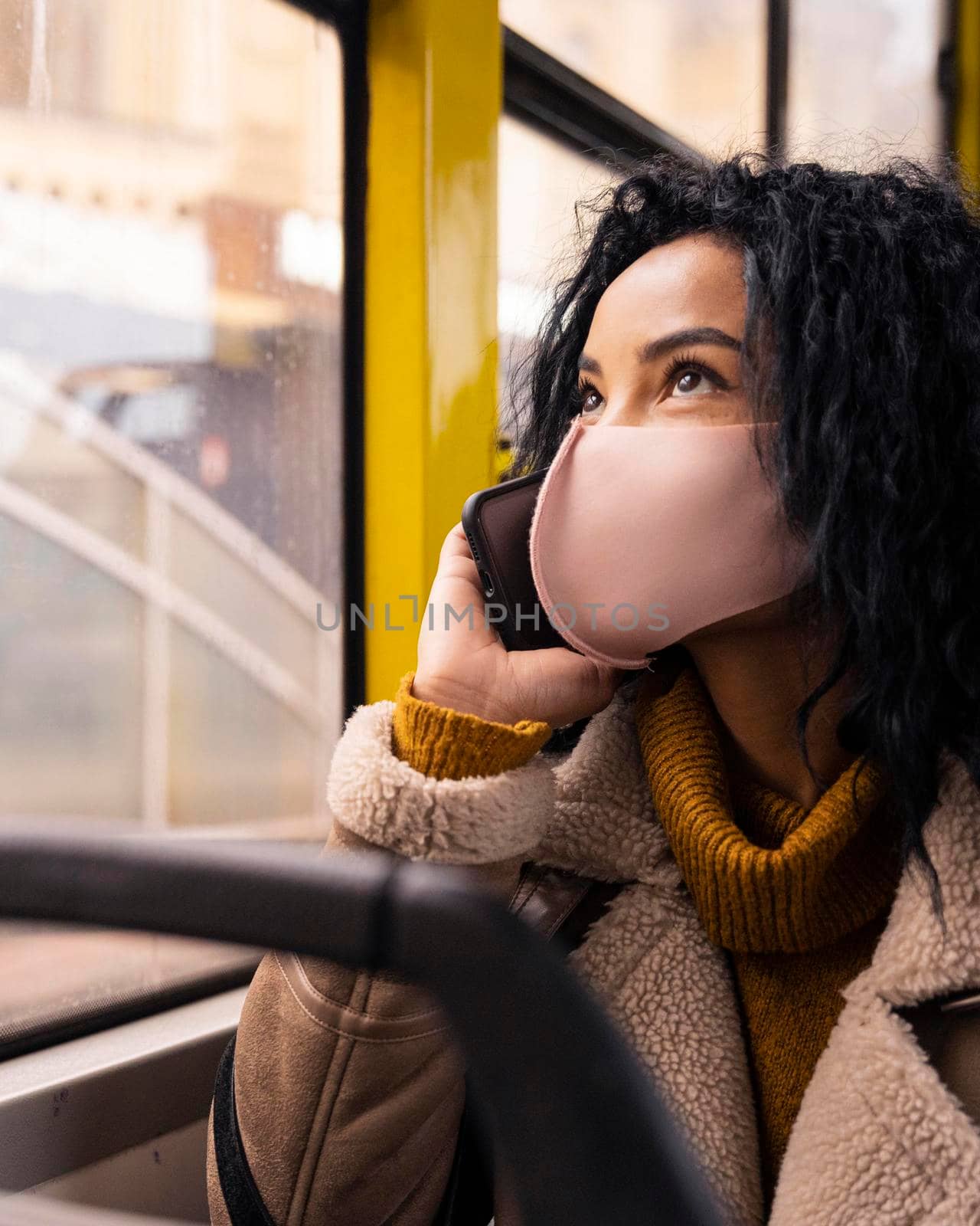 beautiful woman talking phone bus