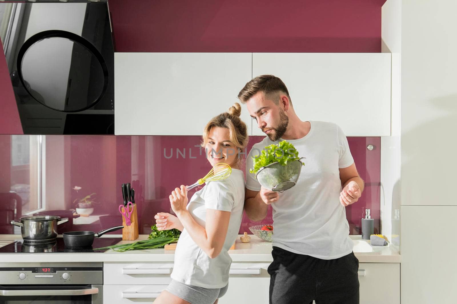 happy couple indoors kitchen