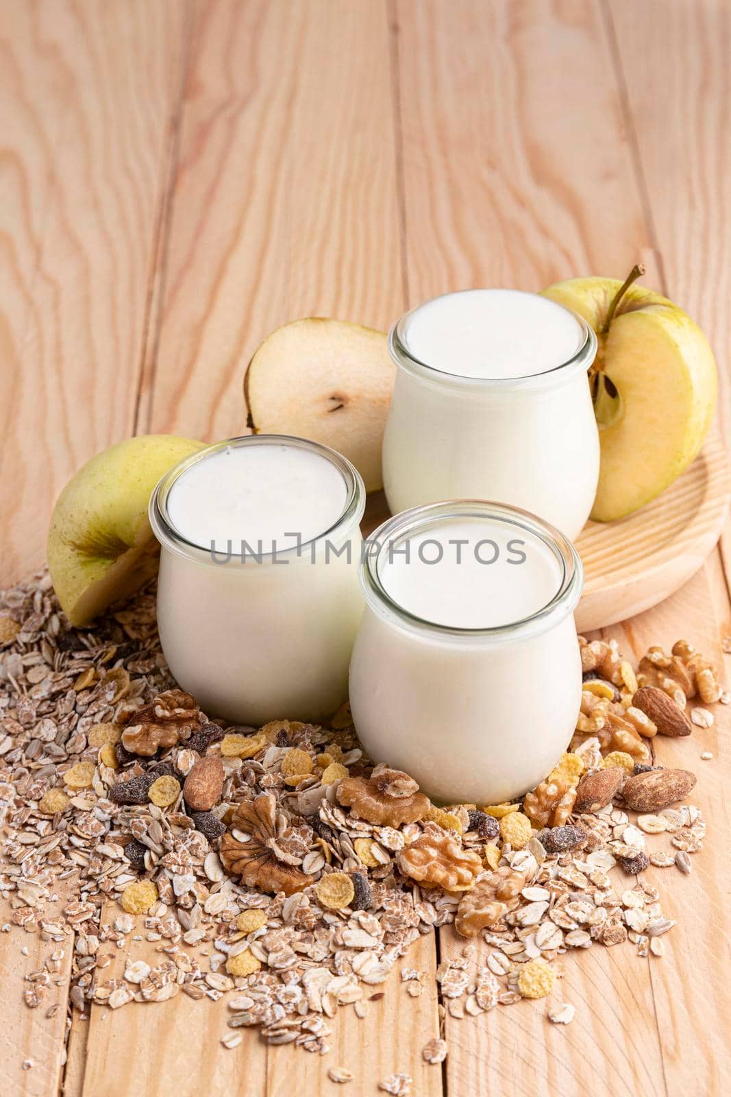 high angle plain yogurt jars with oats apple