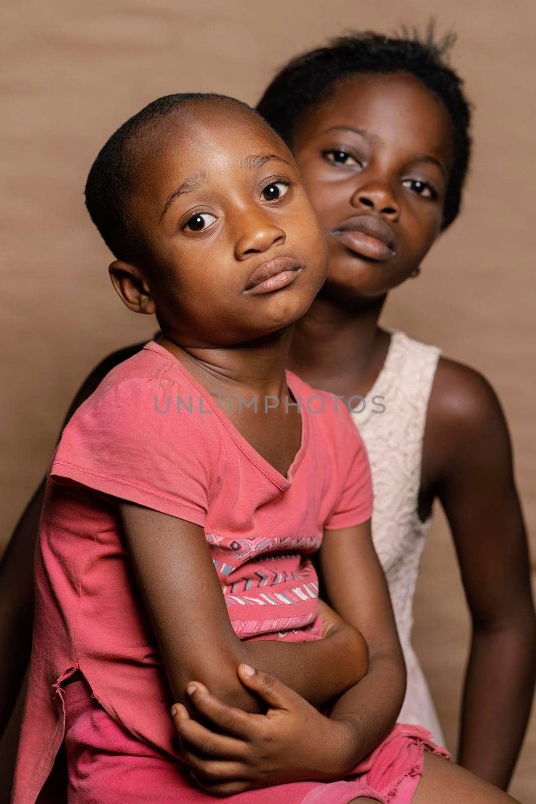 siblings sitting chair