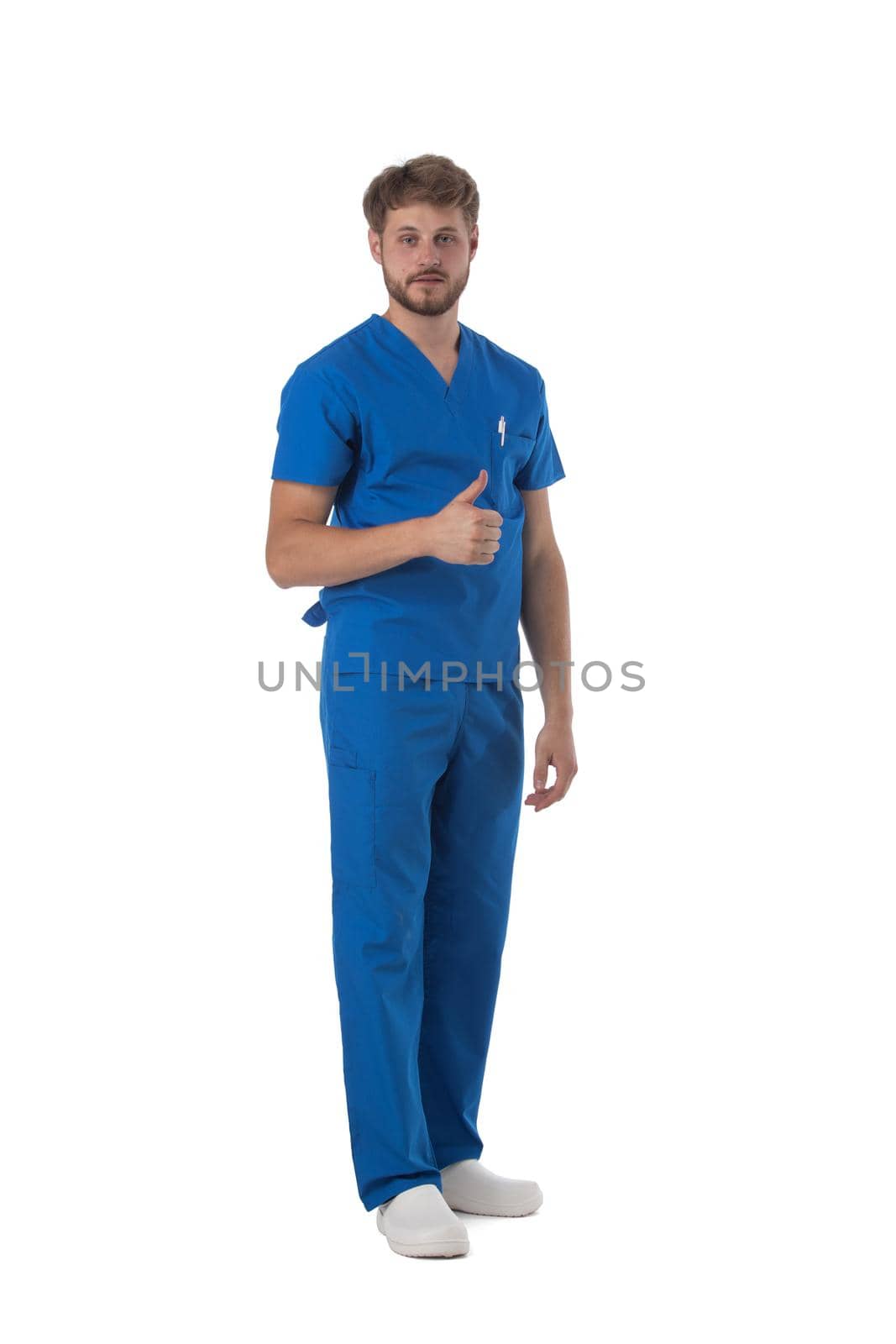Male nurse or doctor in blue uniform with thumb up studio full length portrait isolated on white background