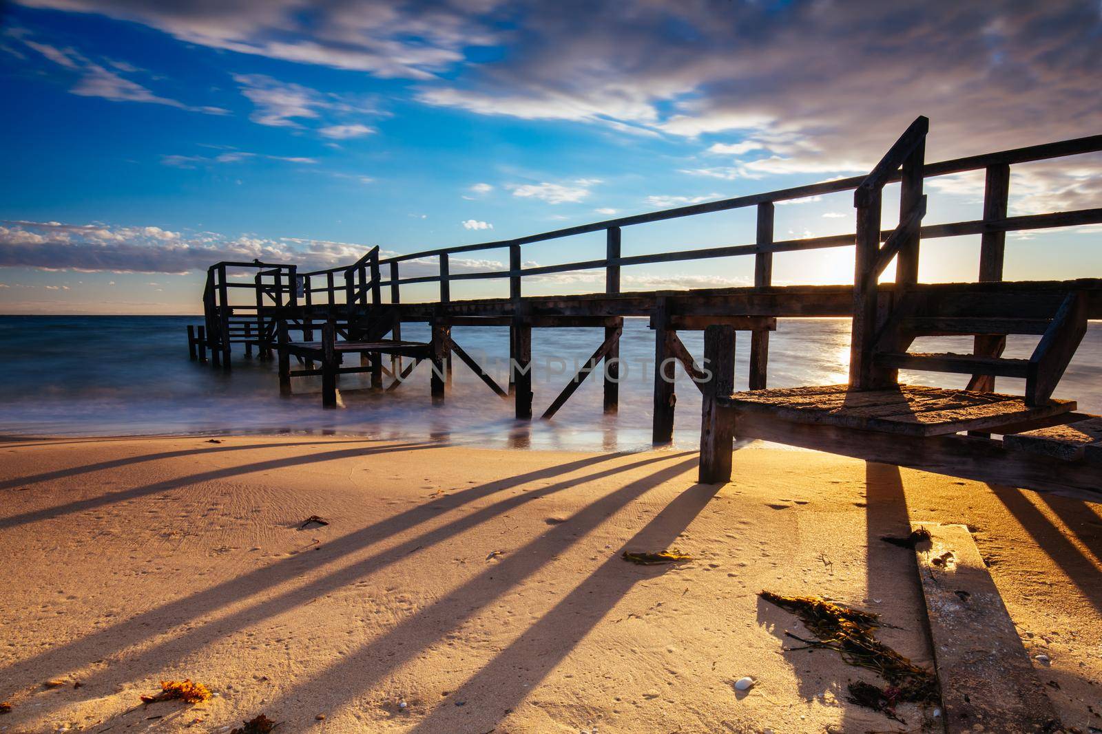 Piers near Millionaire's Walk at Point King Beach on a cool winter's morning at sunrise on the Mornington Peninsula in Sorrento, Victoria, Australia