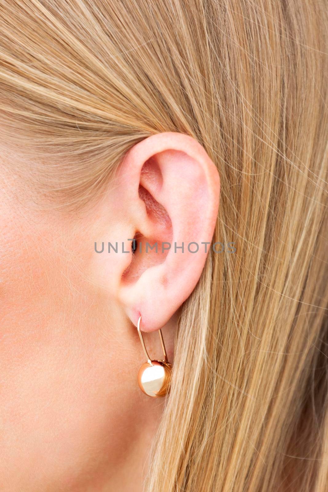 Closeup shot of female ear with earring