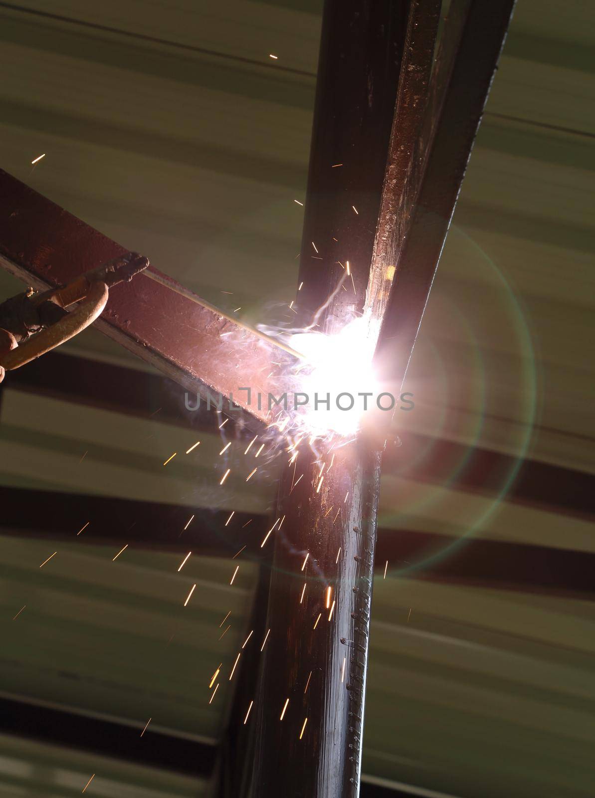 worker us electric welding connecting construction metal 
