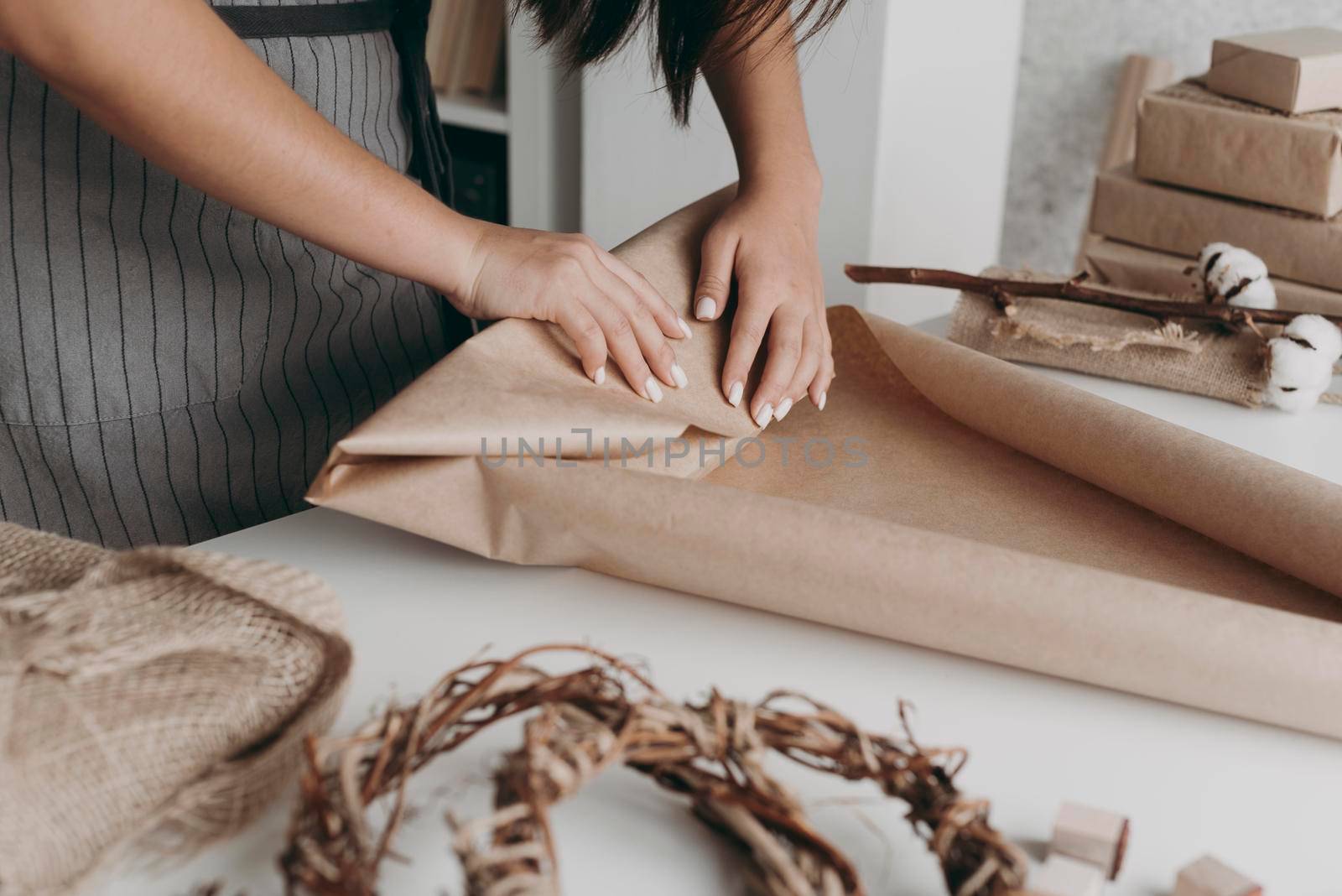 close up hands wrapping paper