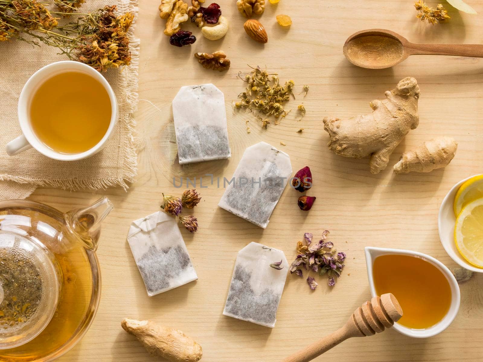 flat lay natural medicinal herbs with tea by Zahard