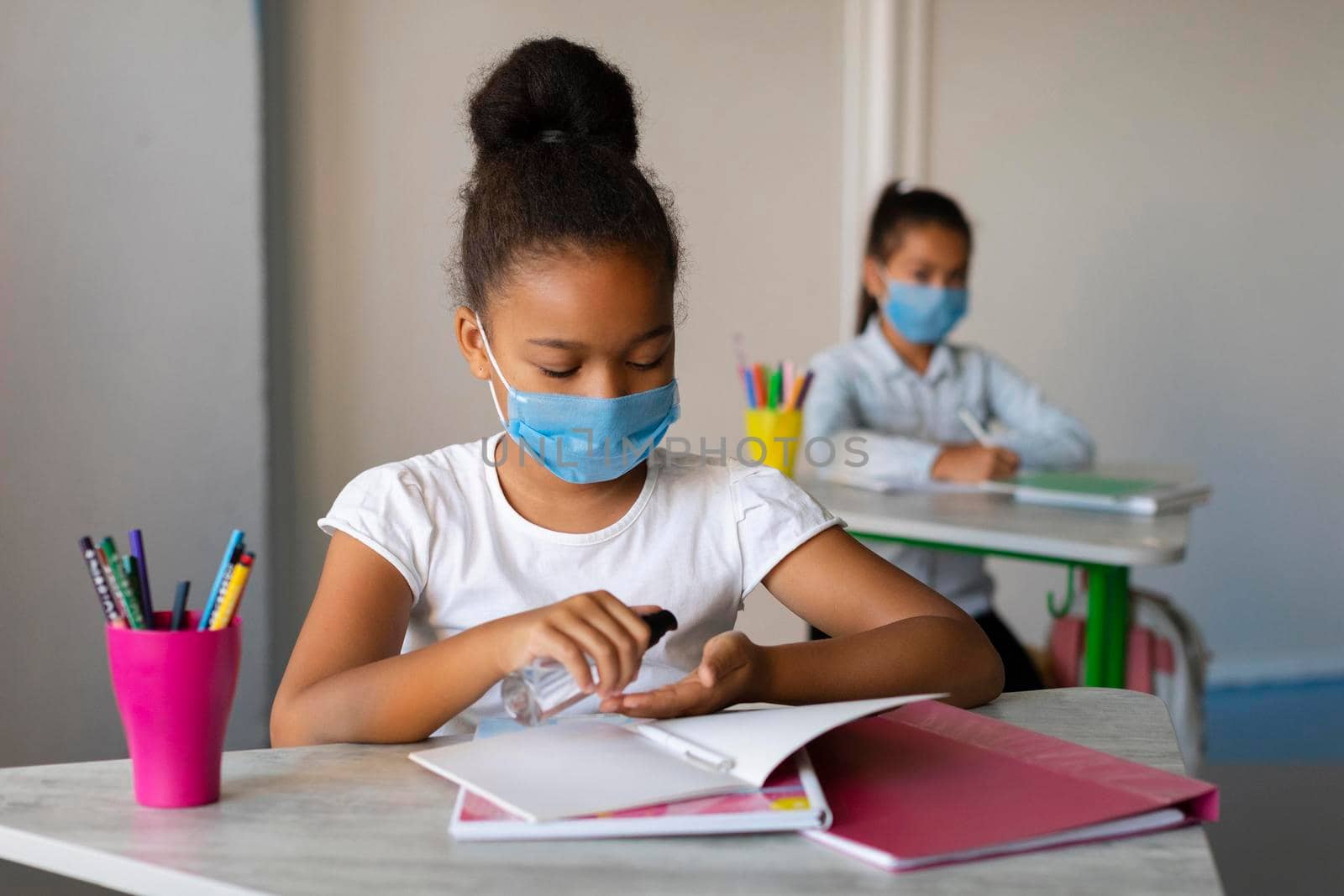 little girl disinfecting her hands class by Zahard