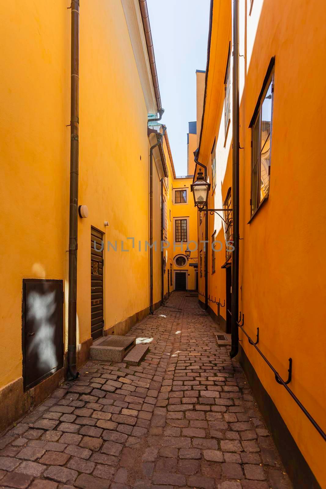 Narrow streets in historic part of town. Old fashioned buildings in Gamla stan. Stockholm, Sweden.