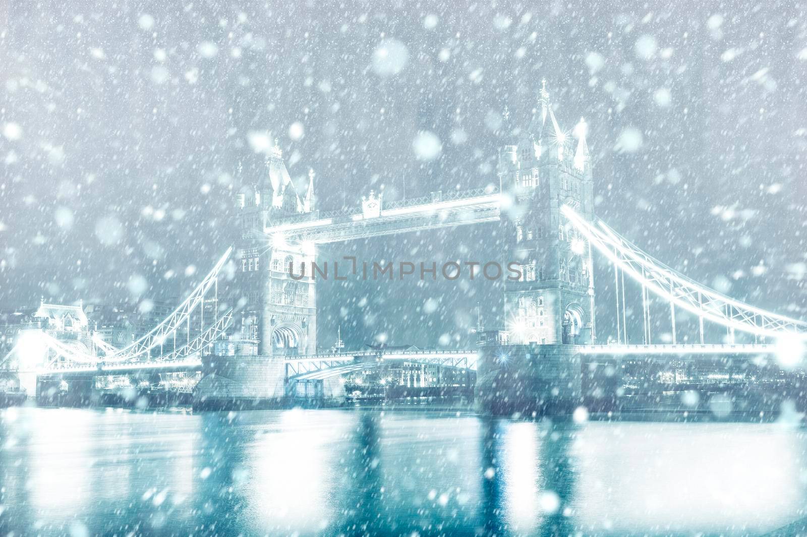 View of Tower Bridge in London with snow by night