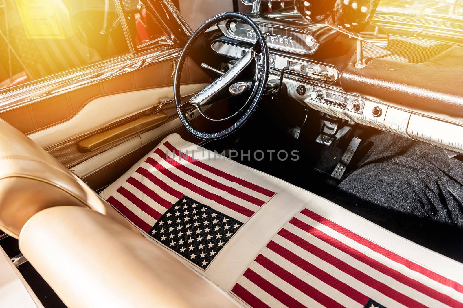 USA flag on seat of a car with sunlight