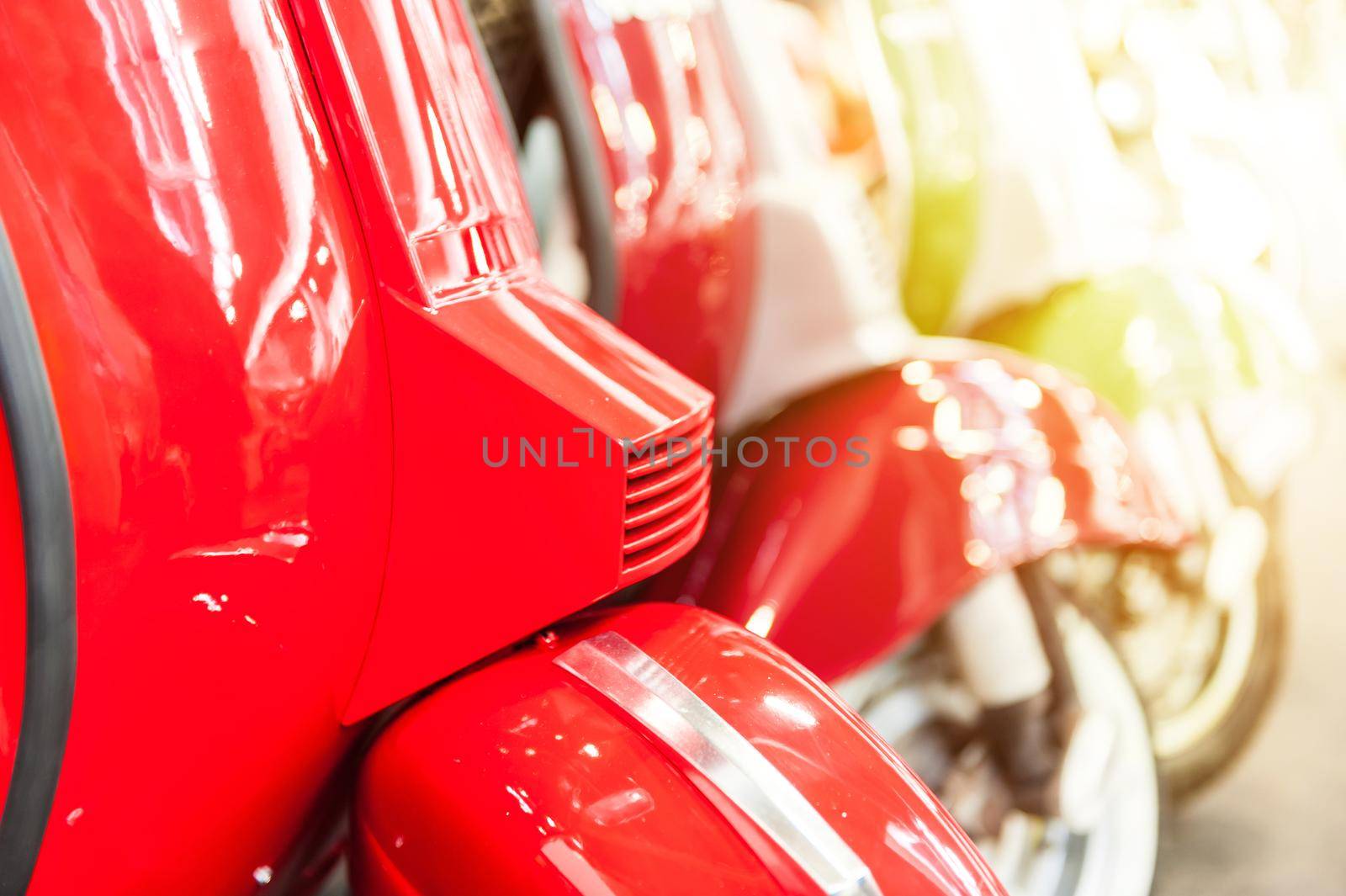 Scooters in a showroom with sunlight