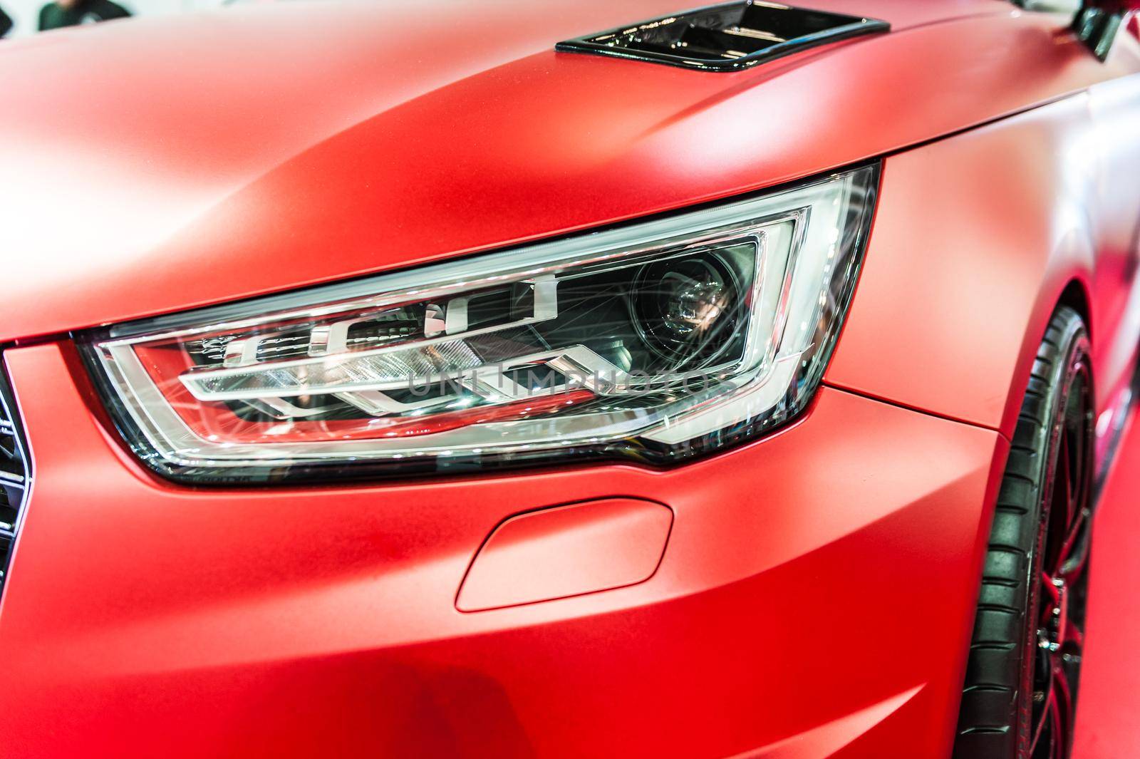 Close up of a red sport luxury car in a showroom