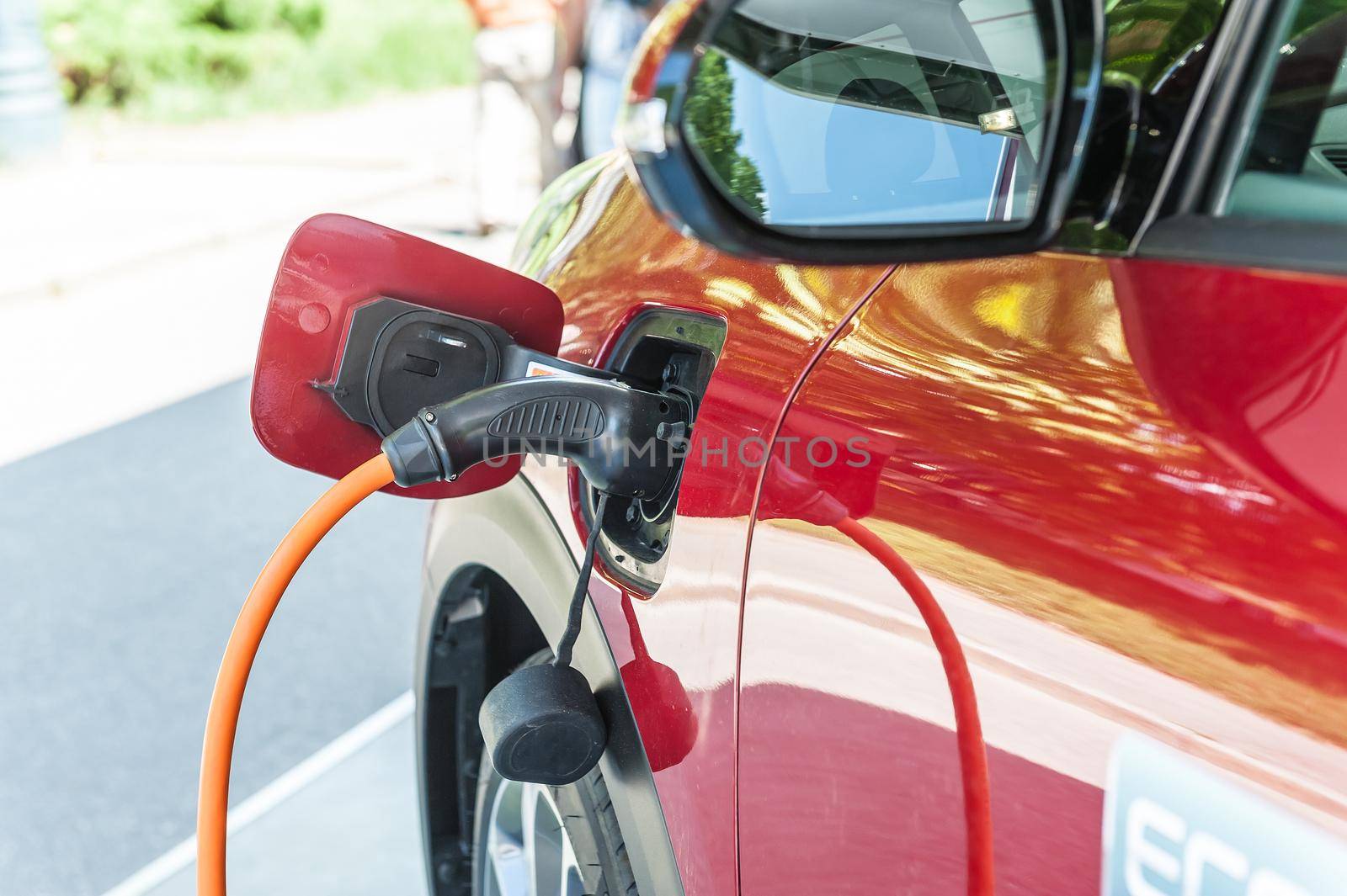 Power supply for electric car charging with red car