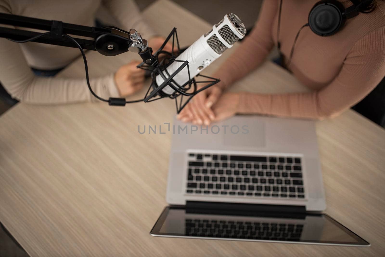 top view women doing radio together