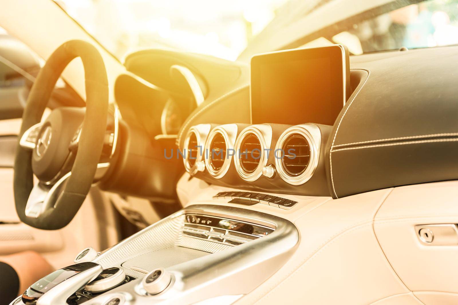 Modern car interior with sunlight in background