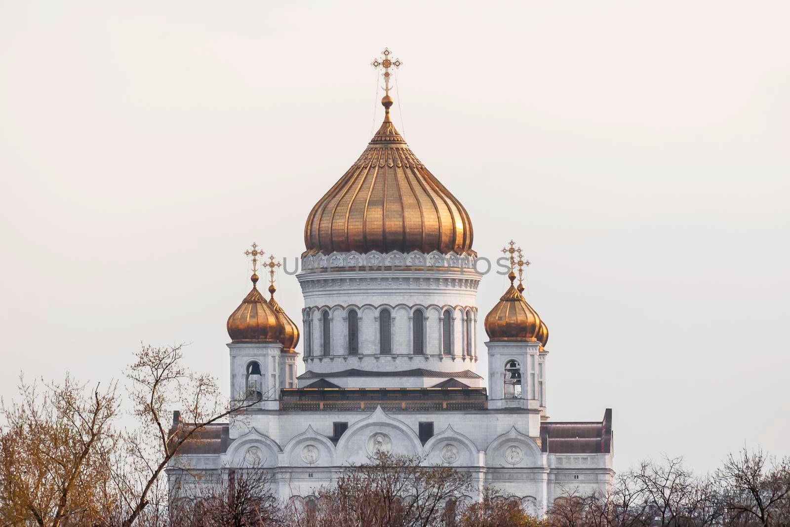 Golden domes of famous orthodox Cathedral of Jesus Christ the Saviour. Spring cloudy day in Moscow, Russia.