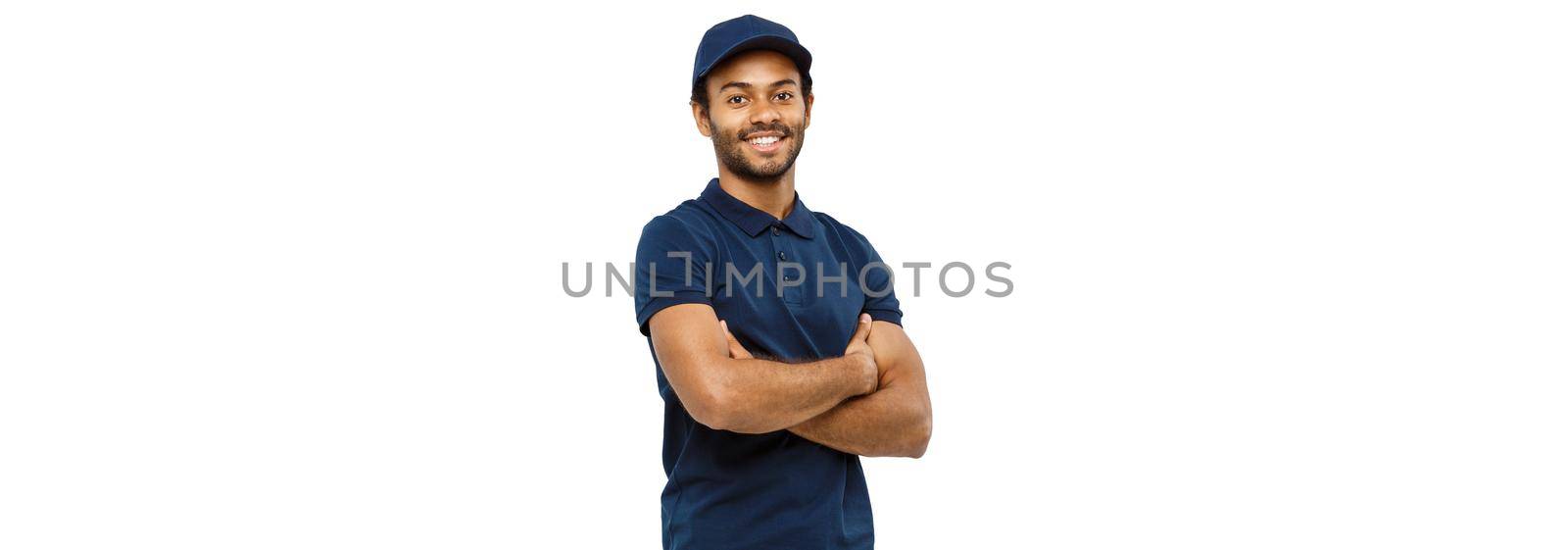 Delivery Concept - Handsome African American delivery man crossed arms over isolated on Grey studio Background. Copy Space