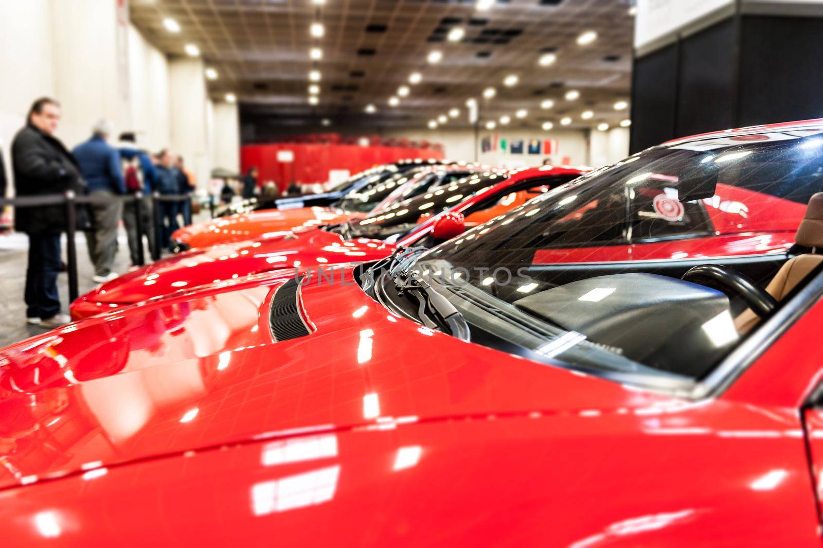 View of many red cars in a showroom