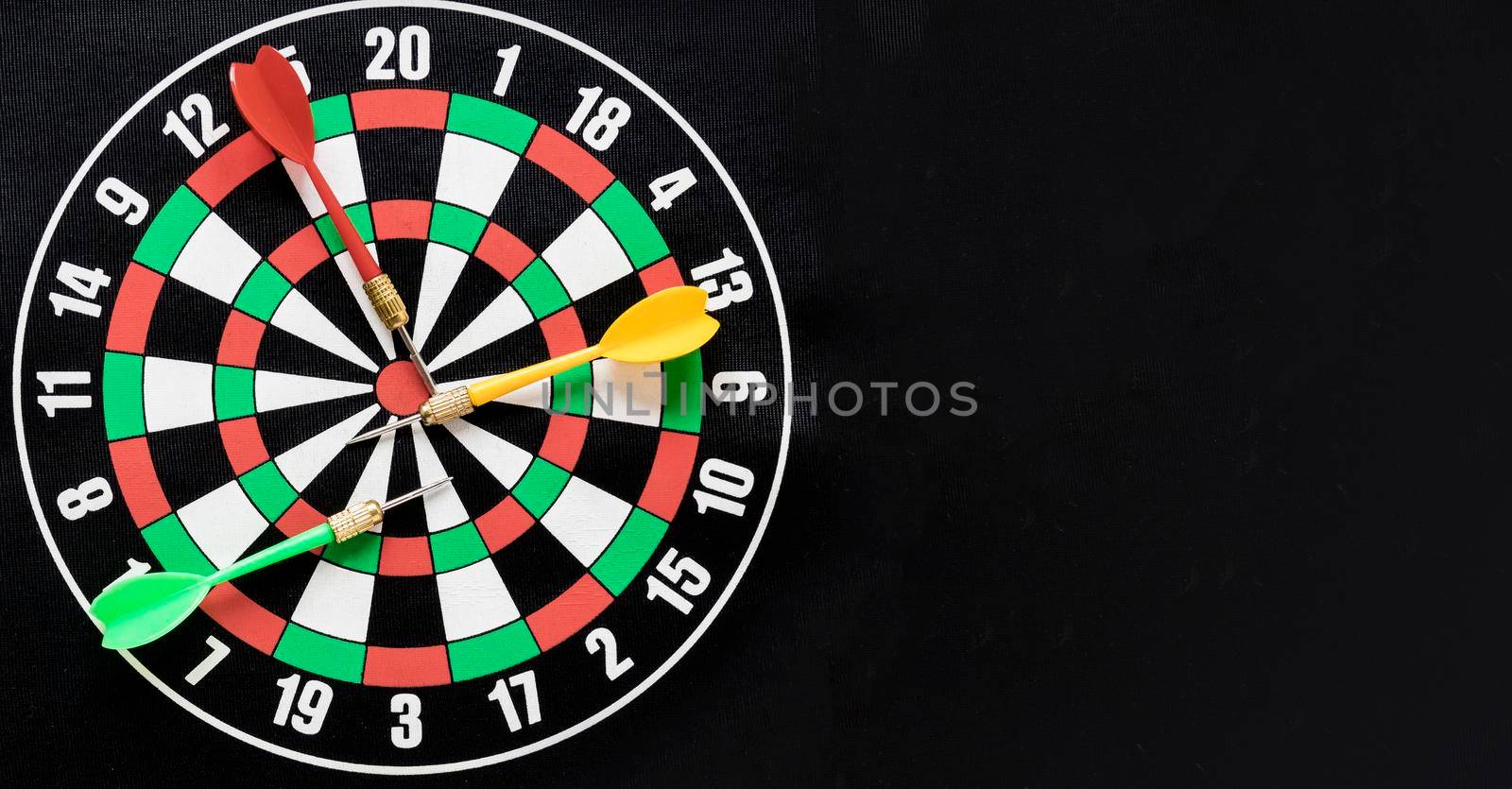 flat lay darts table black background with copy space