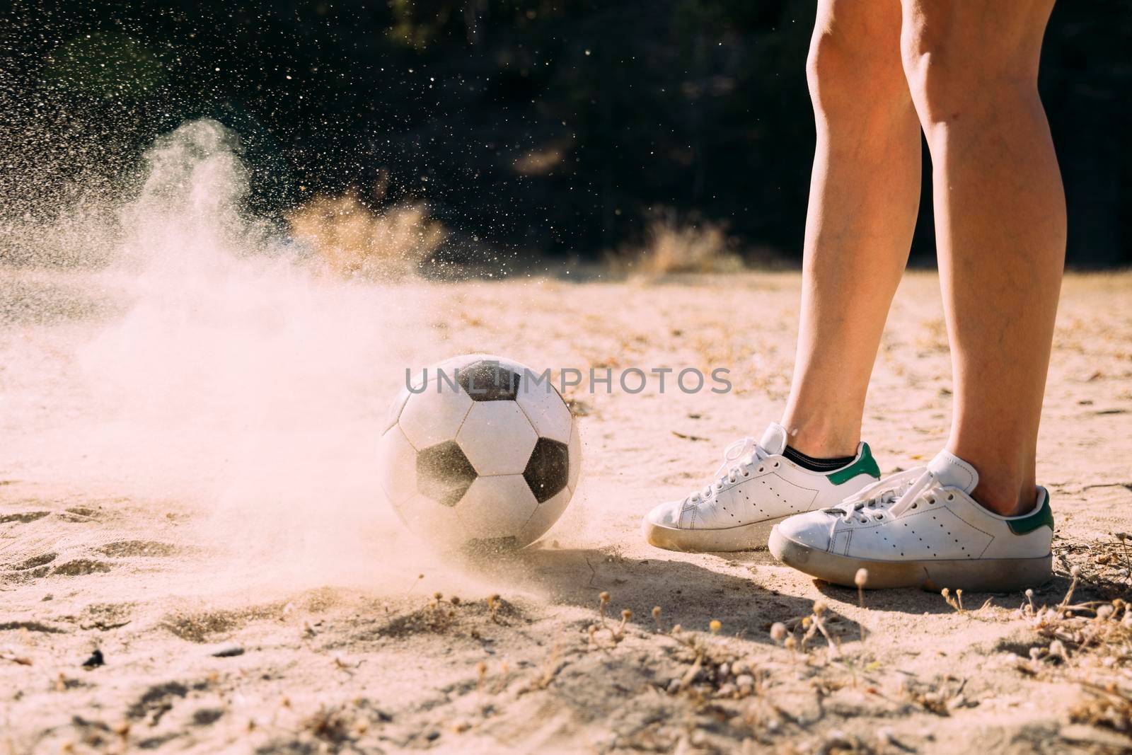 crop athletic legs standing by football outdoors by Zahard