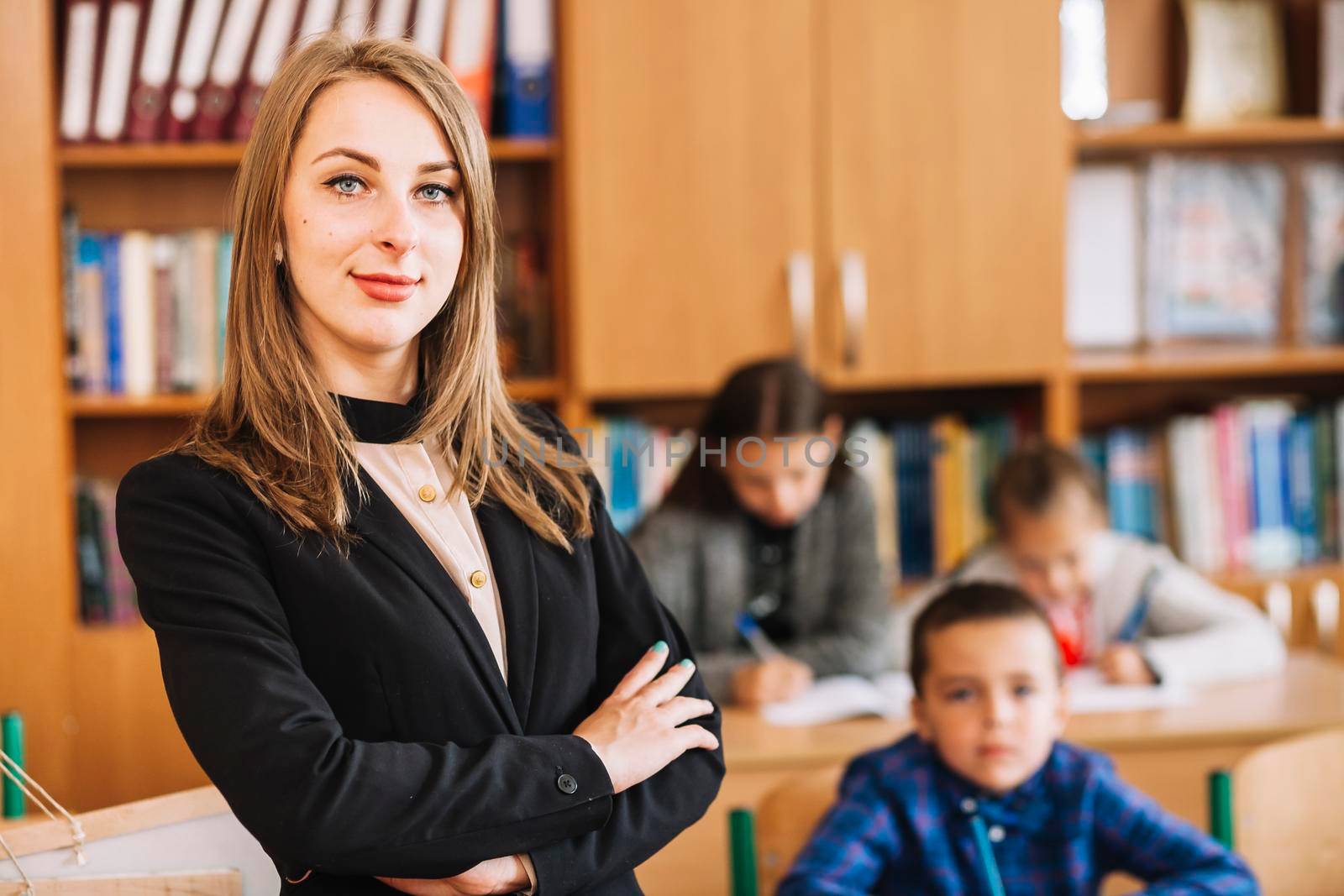 female teacher blurred background classroom
