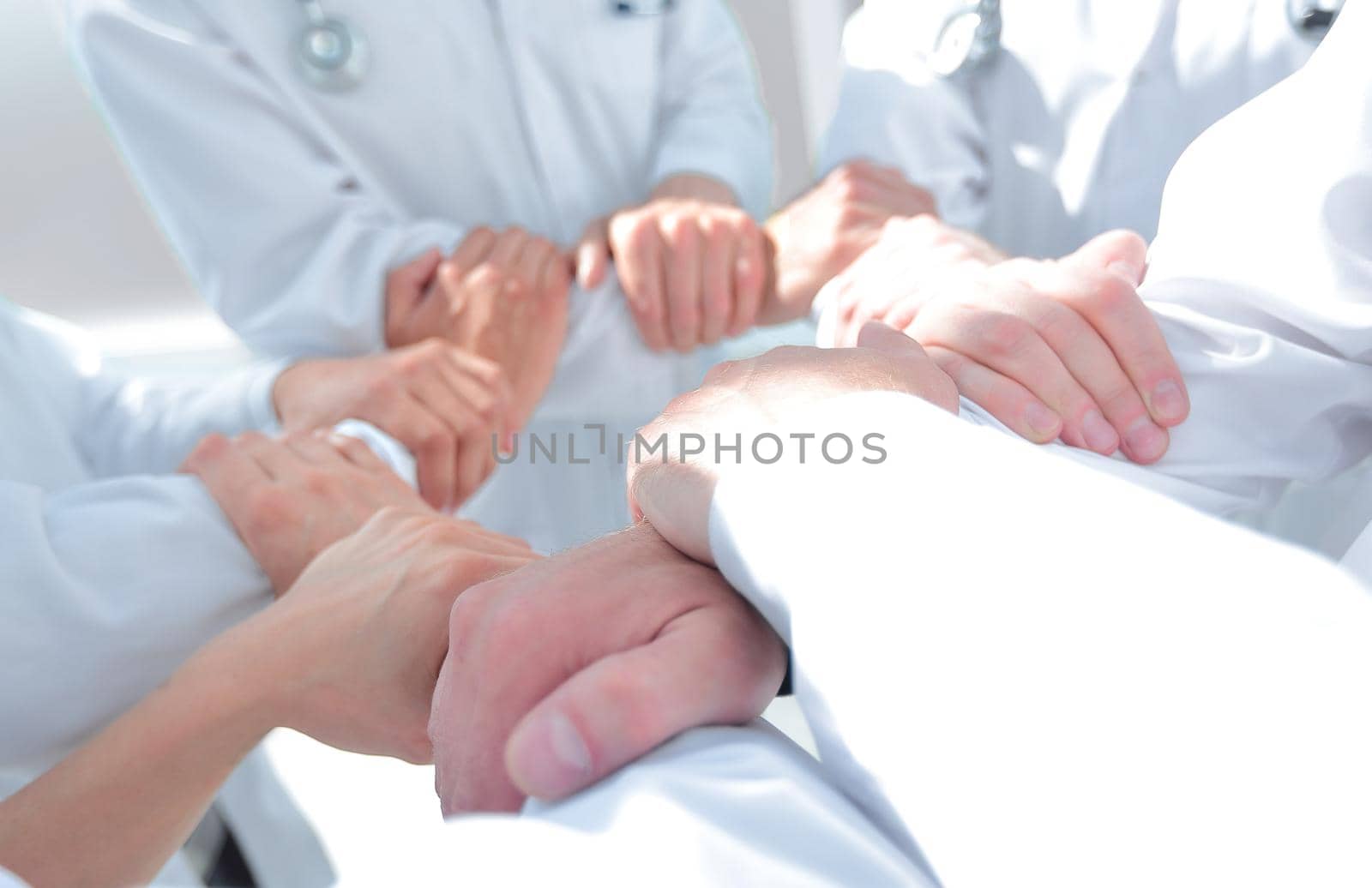 close up.background image of doctors standing together. the concept of teamwork
