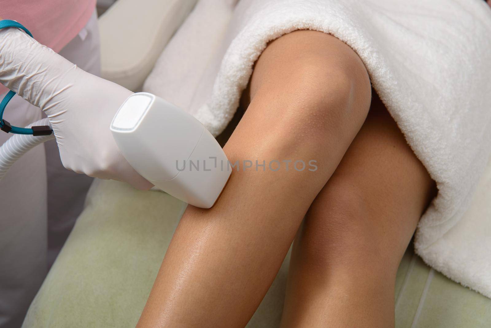 Laser hair removal on ladies legs. woman in beige lingerie by Ashtray25