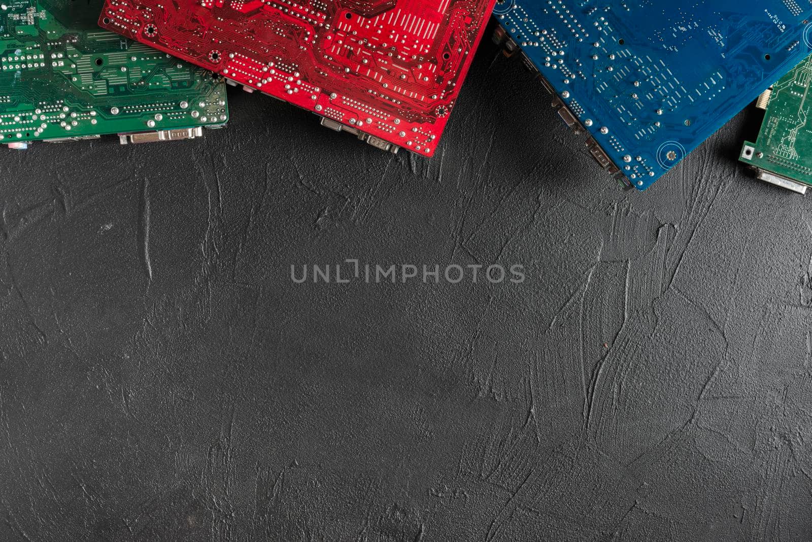 elevated view colorful computer circuit boards black backdrop by Zahard
