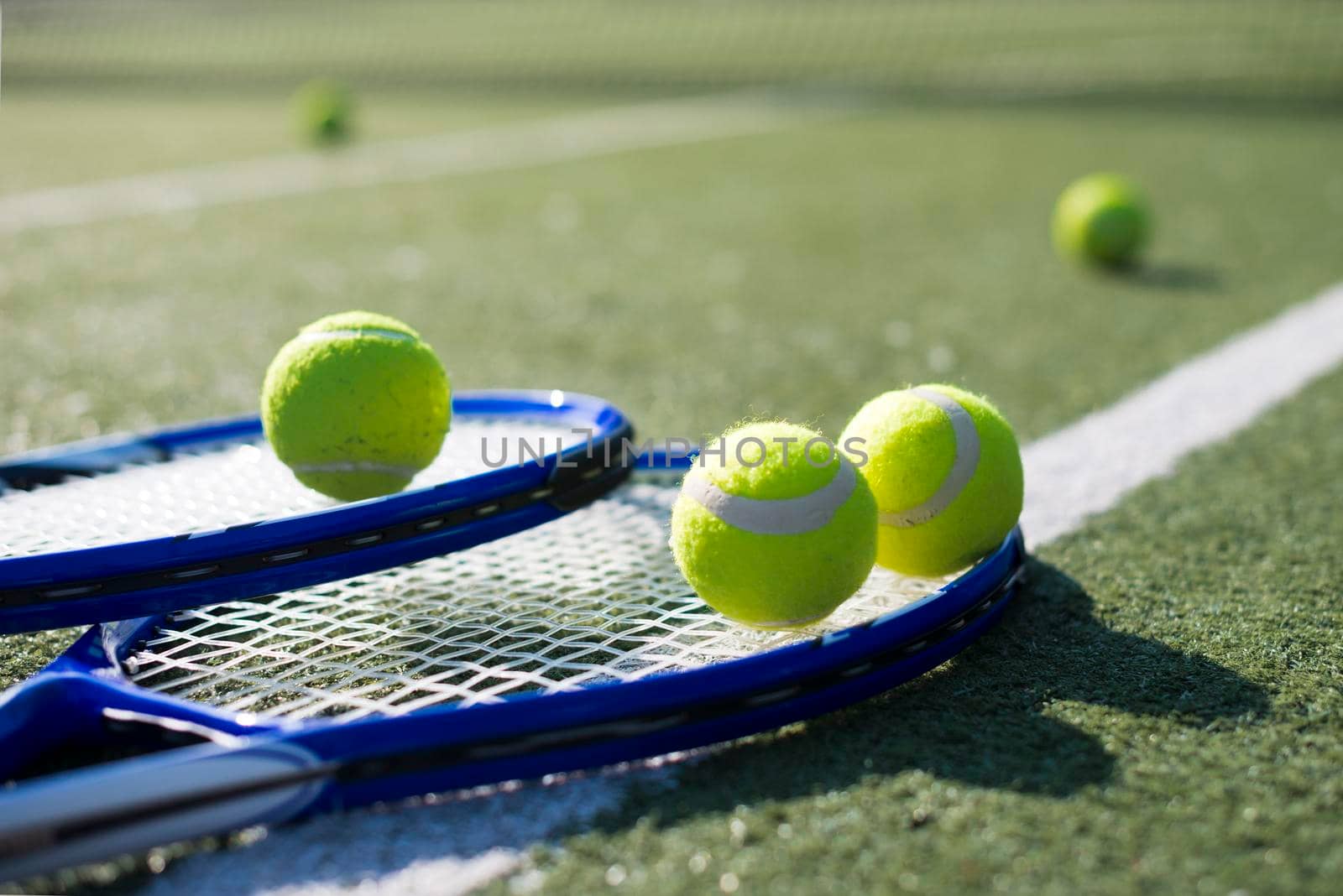 close up tennis rackets balls ground by Zahard