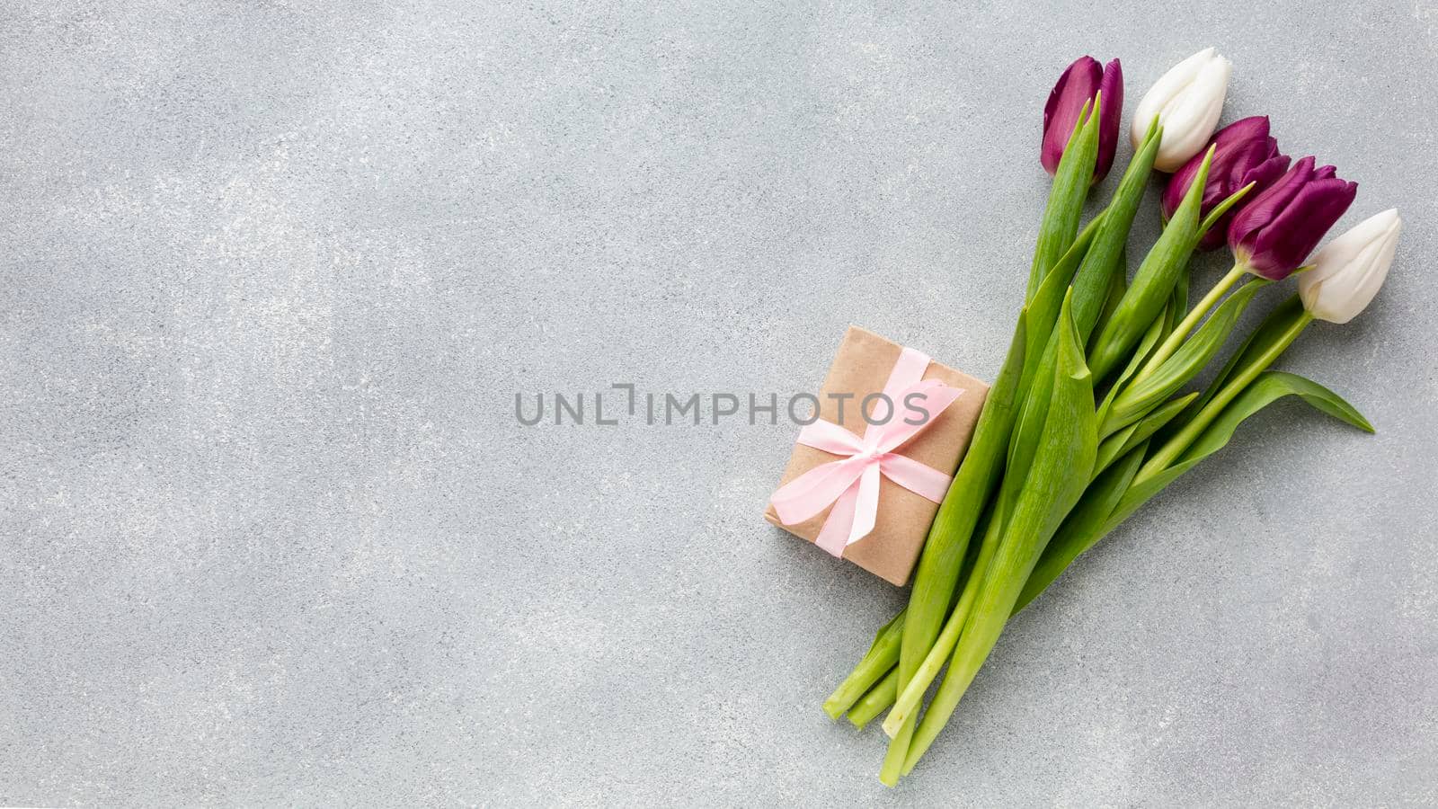 bouquet tulips with wrapped gift copy space by Zahard