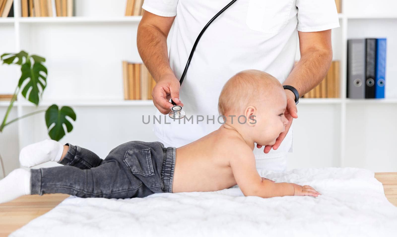 doctor hands listening baby patient with stethoscope by Zahard