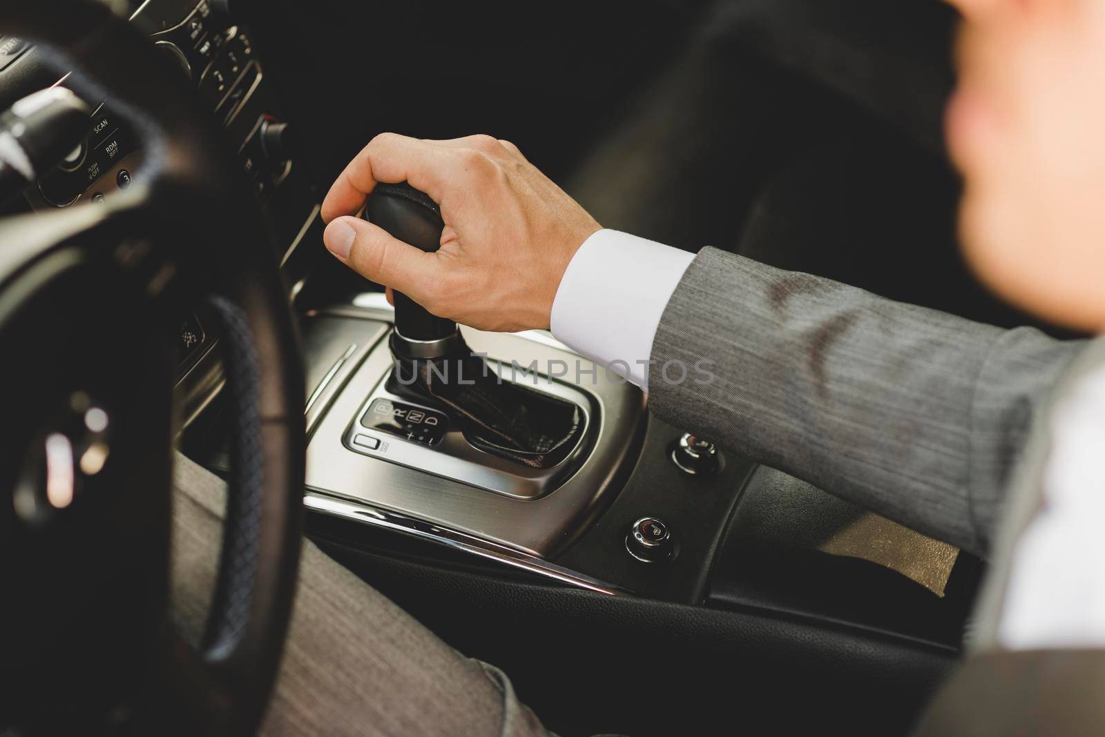 elevated view businessman driving car moving transmission shift gear by Zahard